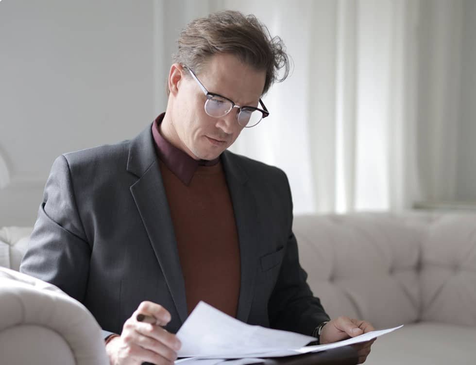 Man Reading Papers